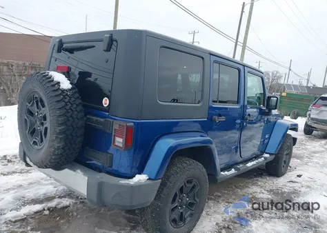 2009 Jeep Wrangler Unlimited Sahara z USA, uszkodzony, nr VIN 1J4GA59129L712696